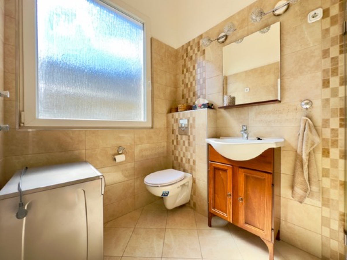 Bathroom, large window and washing machine